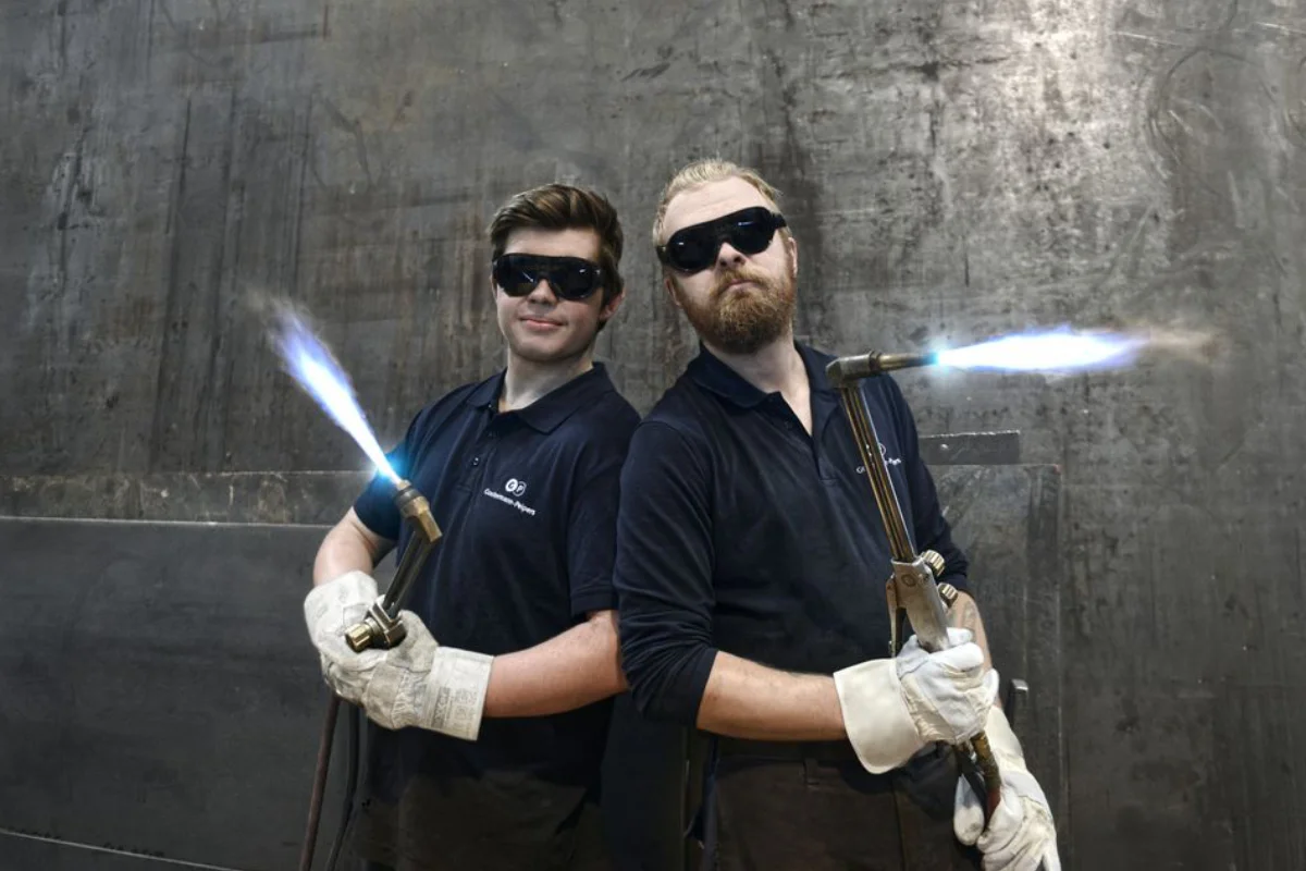 Teamfoto, Konstruktionsmechaniker, Metallindustrie, Gießerei, Eisen, Siegen, Mannschaft, Mitarbeiter, Gussprodukte